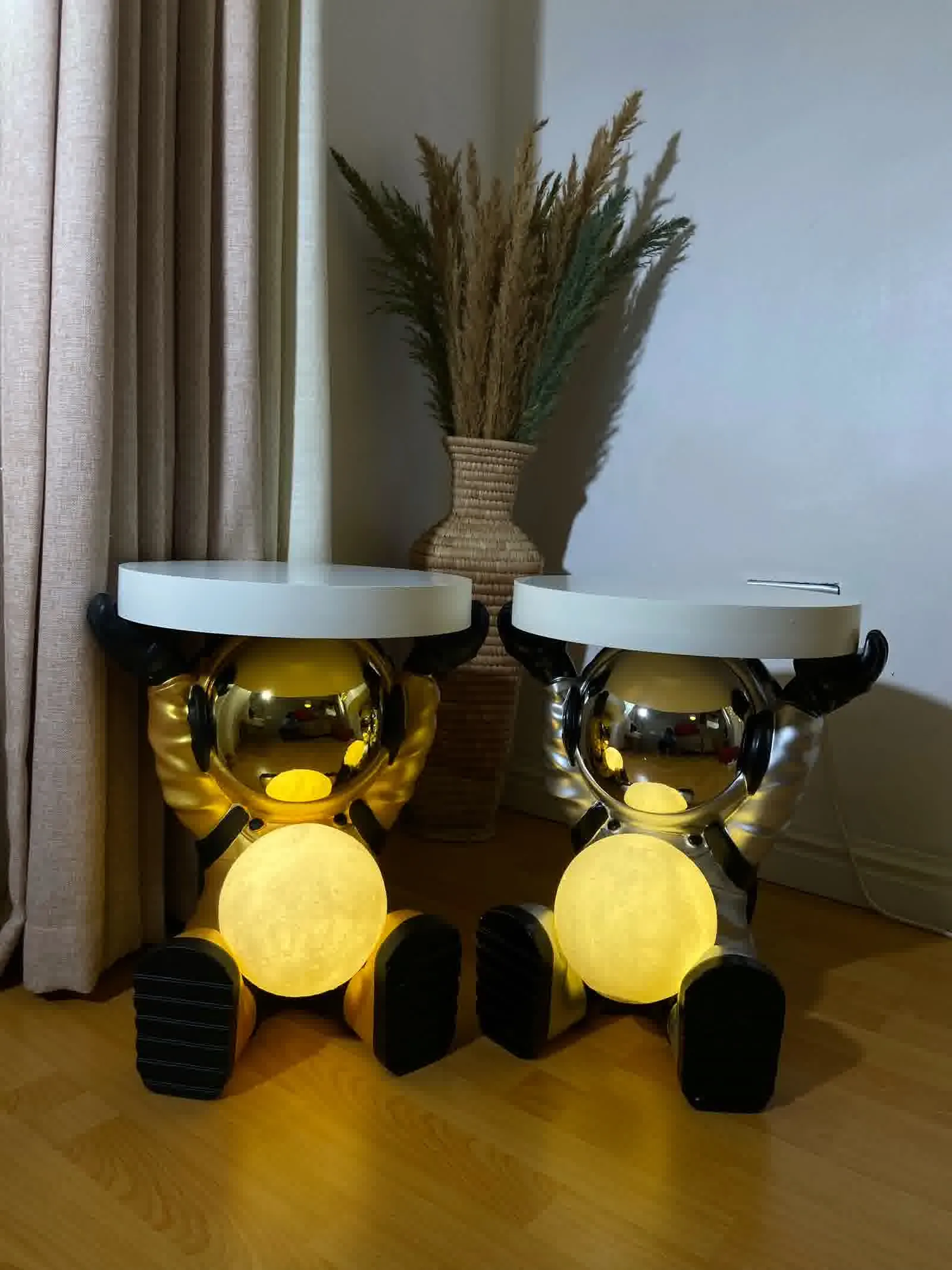 Large astronaut floor lamp casting ambient light in a modern living room