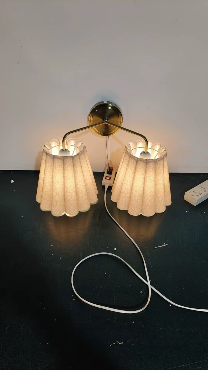 Sculptural wall-mounted lamp with directional warm lighting